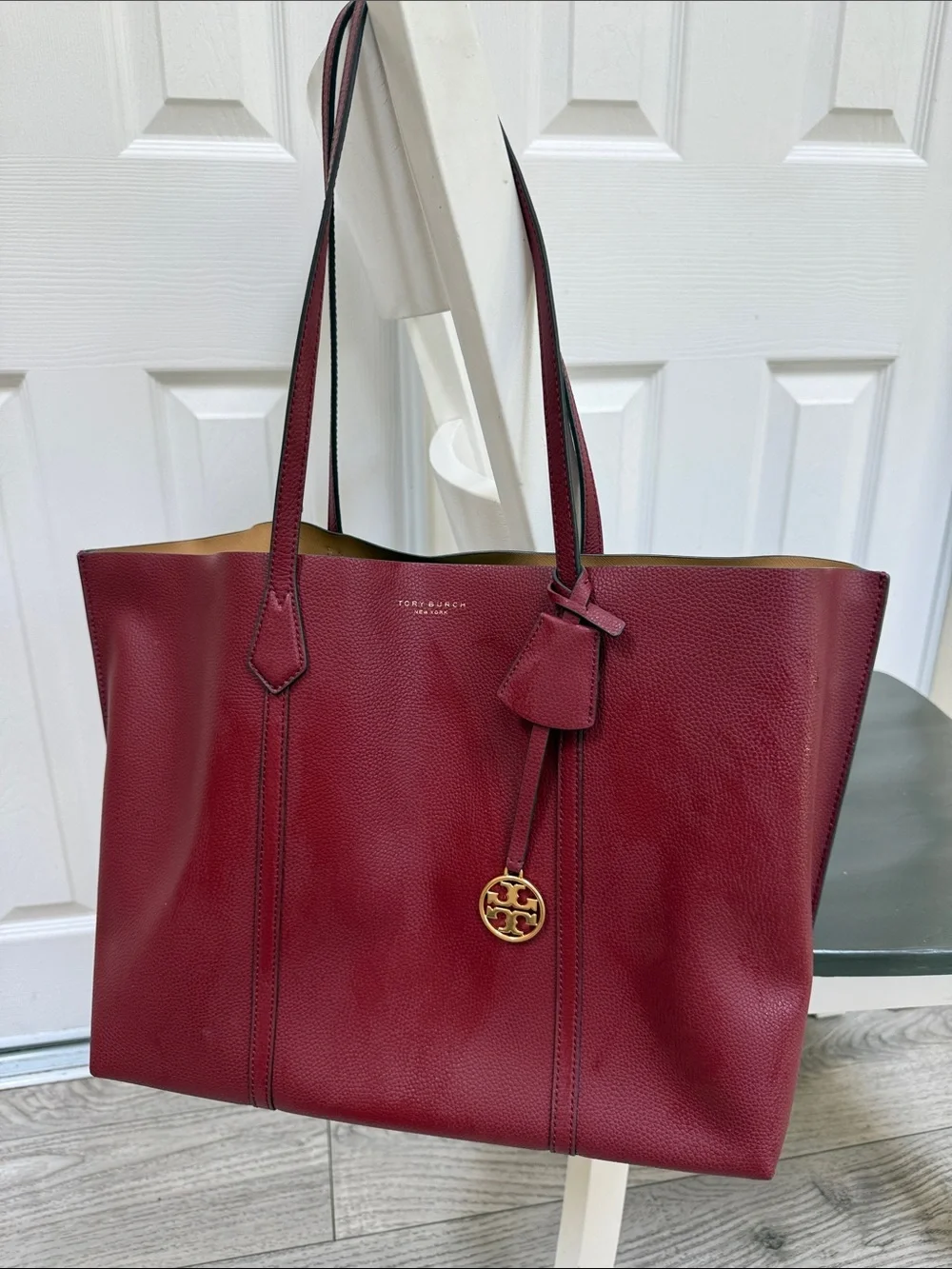 Tory Burch Wine Red Pebbled Leather Tote with Gold Logo Charm